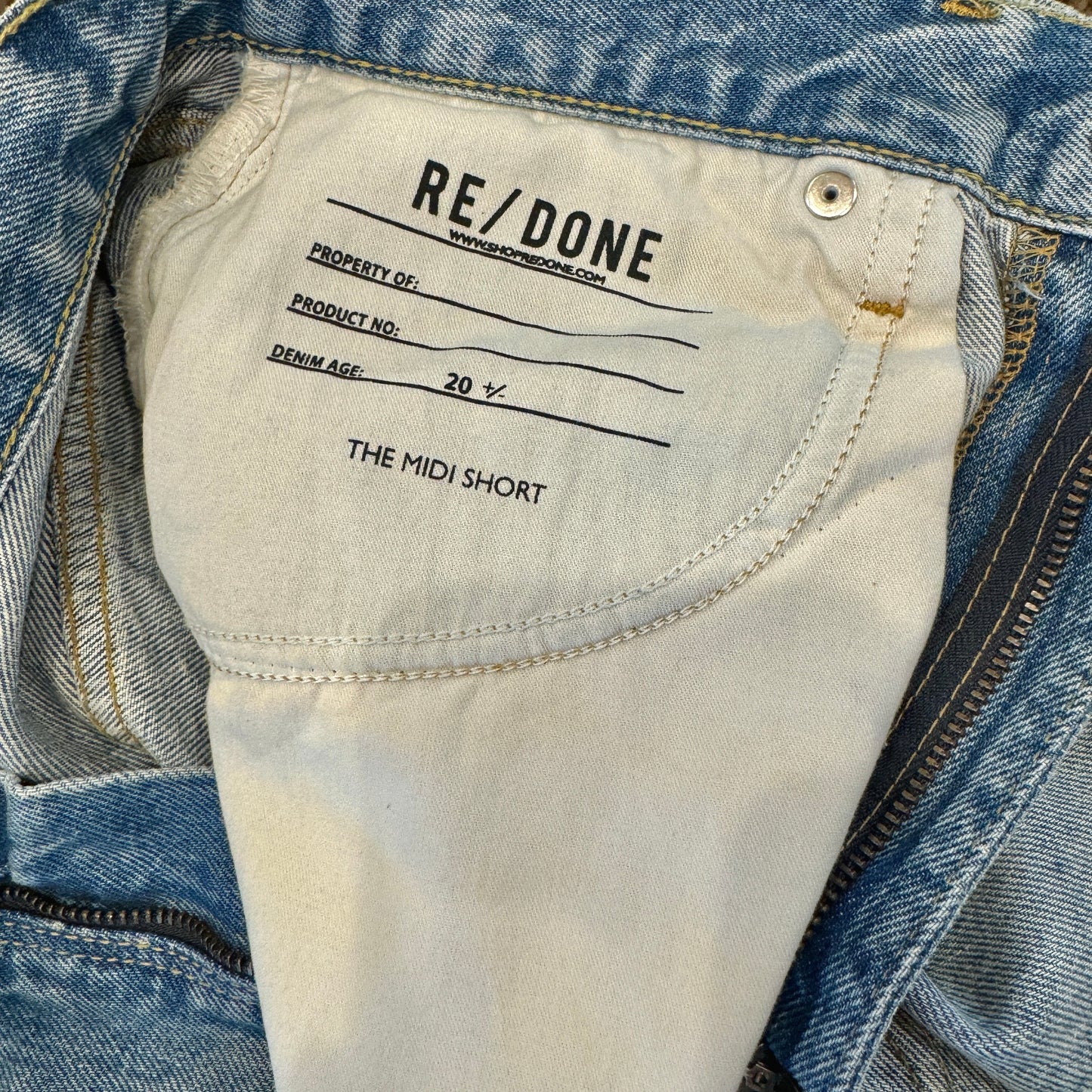 Re/Done Denim Shorts The Midi Short in Ripped Tide Light Wash