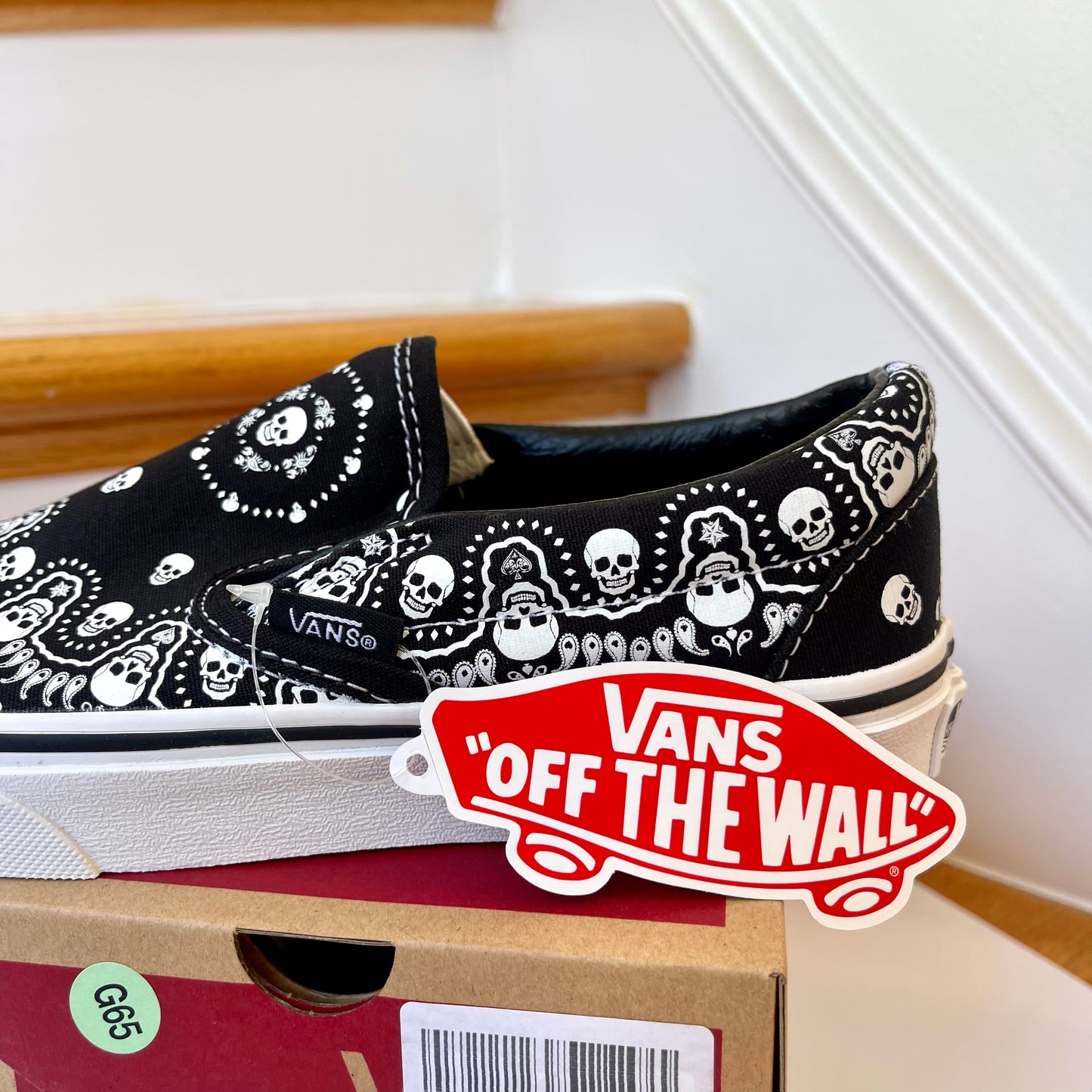 Vans Classic Slip On shoes in black / white bandana skull skate sneaker