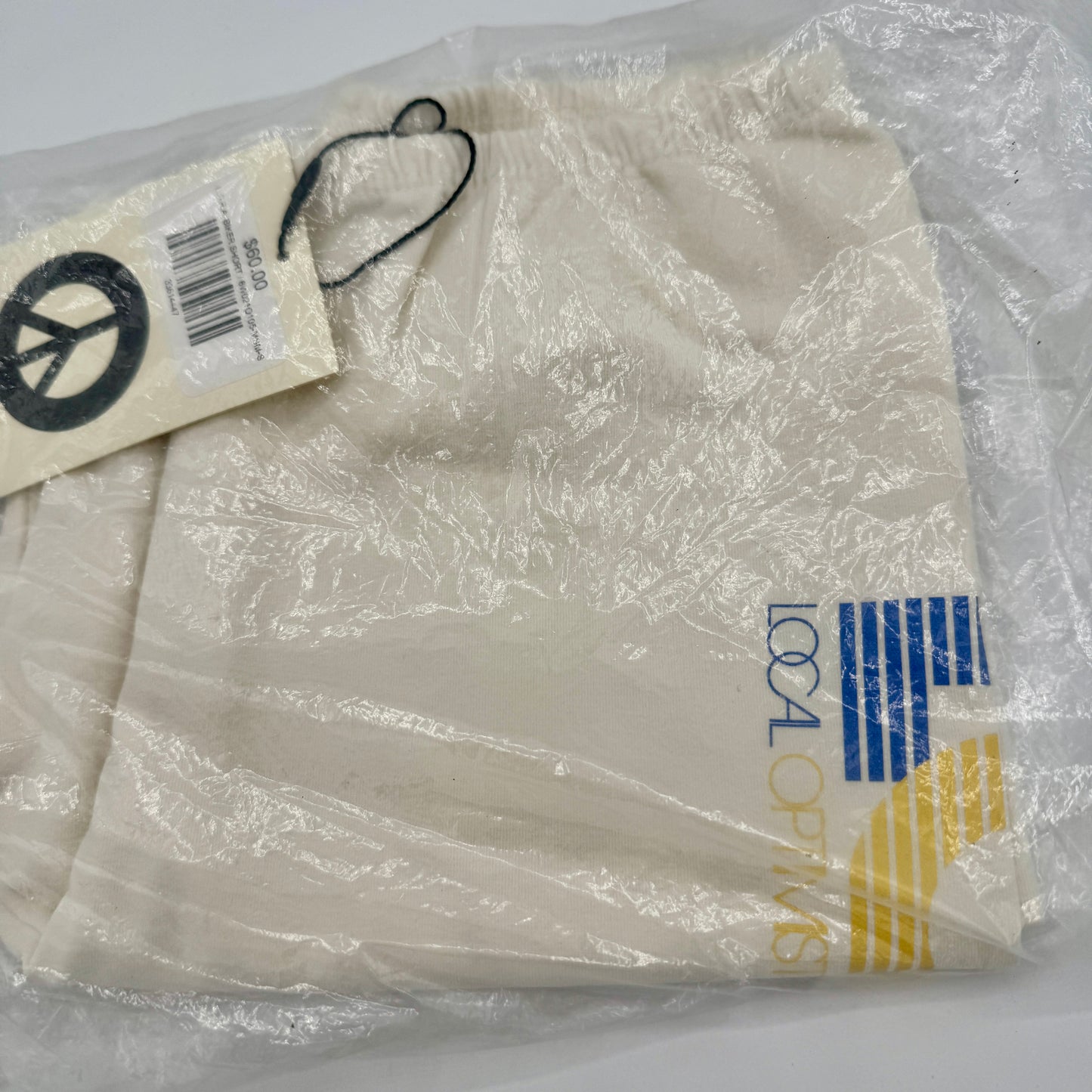 MadHappy Local Optimist Run Club Biker Shorts in Marshmallow / Cream