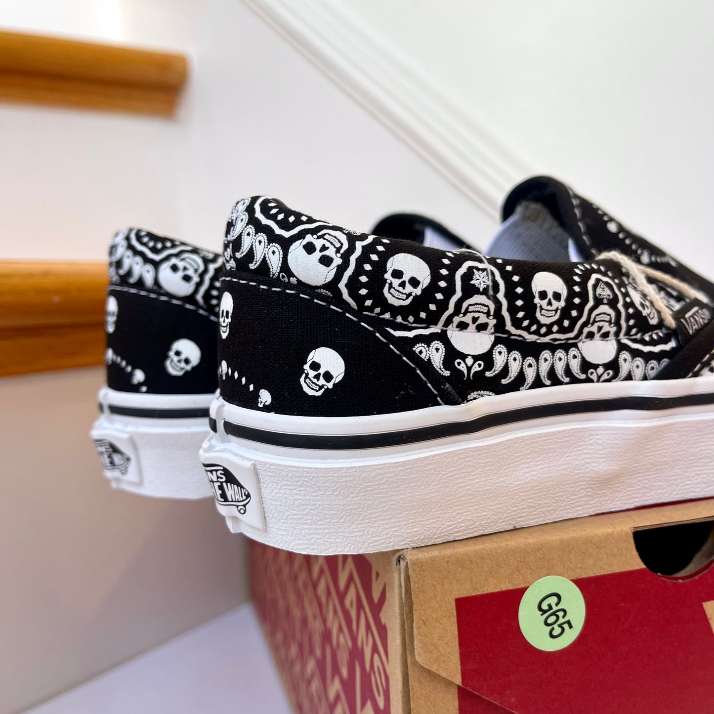 Vans Classic Slip On shoes in black / white bandana skull skate sneaker