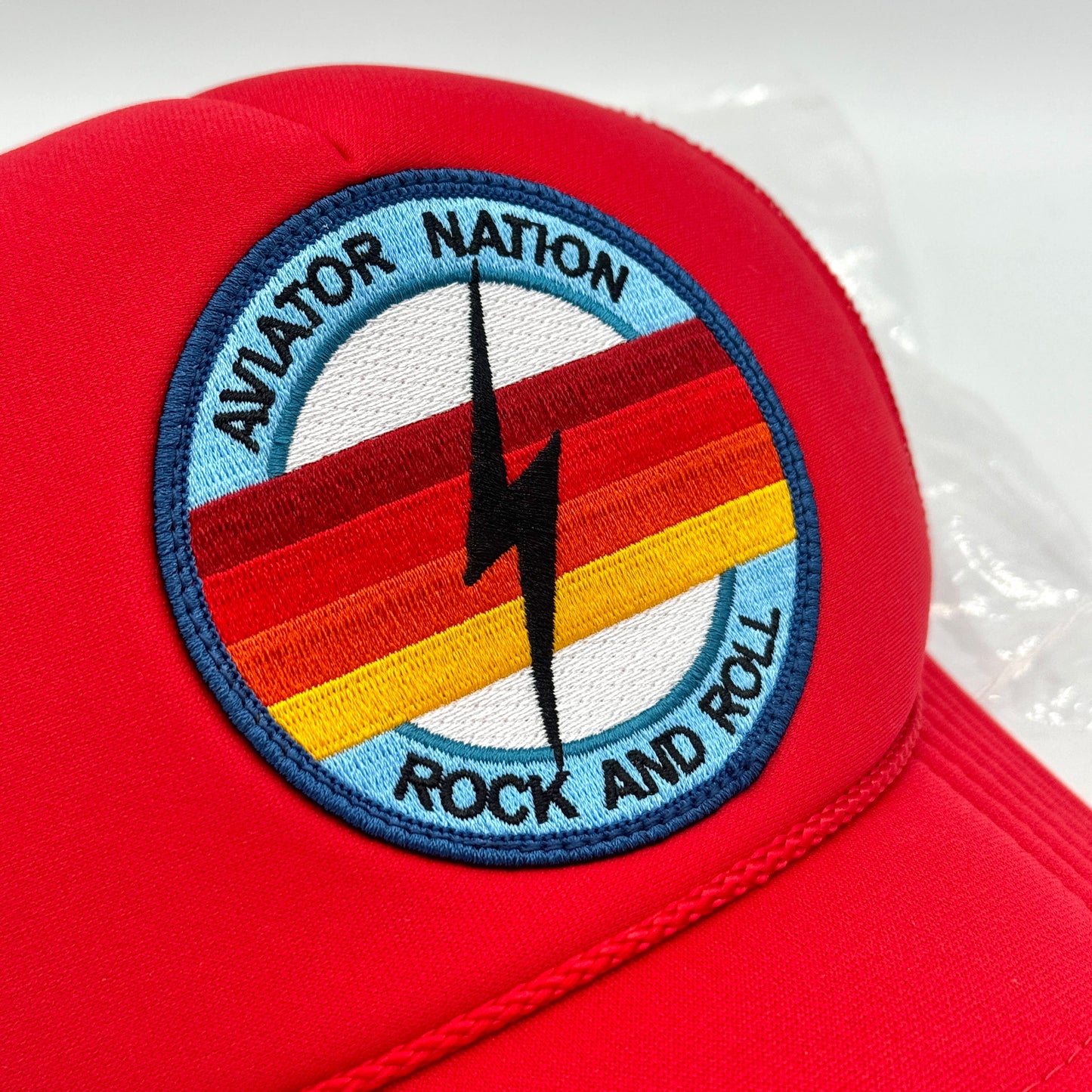 Aviator Nation Bolt Trucker Hat in Red with Rock and roll logo patch