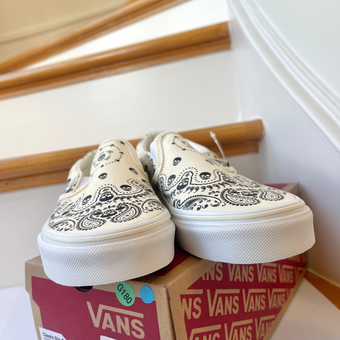 Vans Classic Slip On shoes in black / cream bandana skull skate sneaker