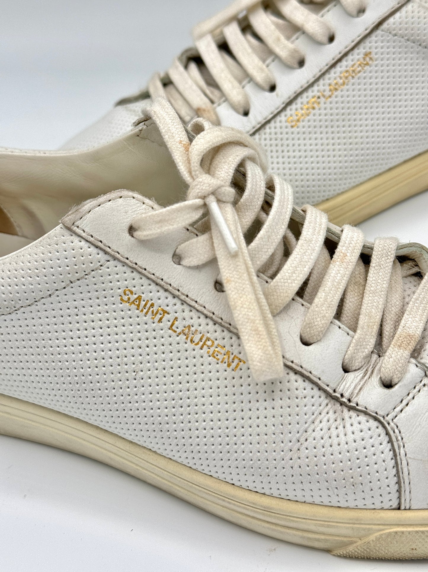 Saint Laurent Pre-Owned Perforated Andy leather sneakers in white with leopard trim