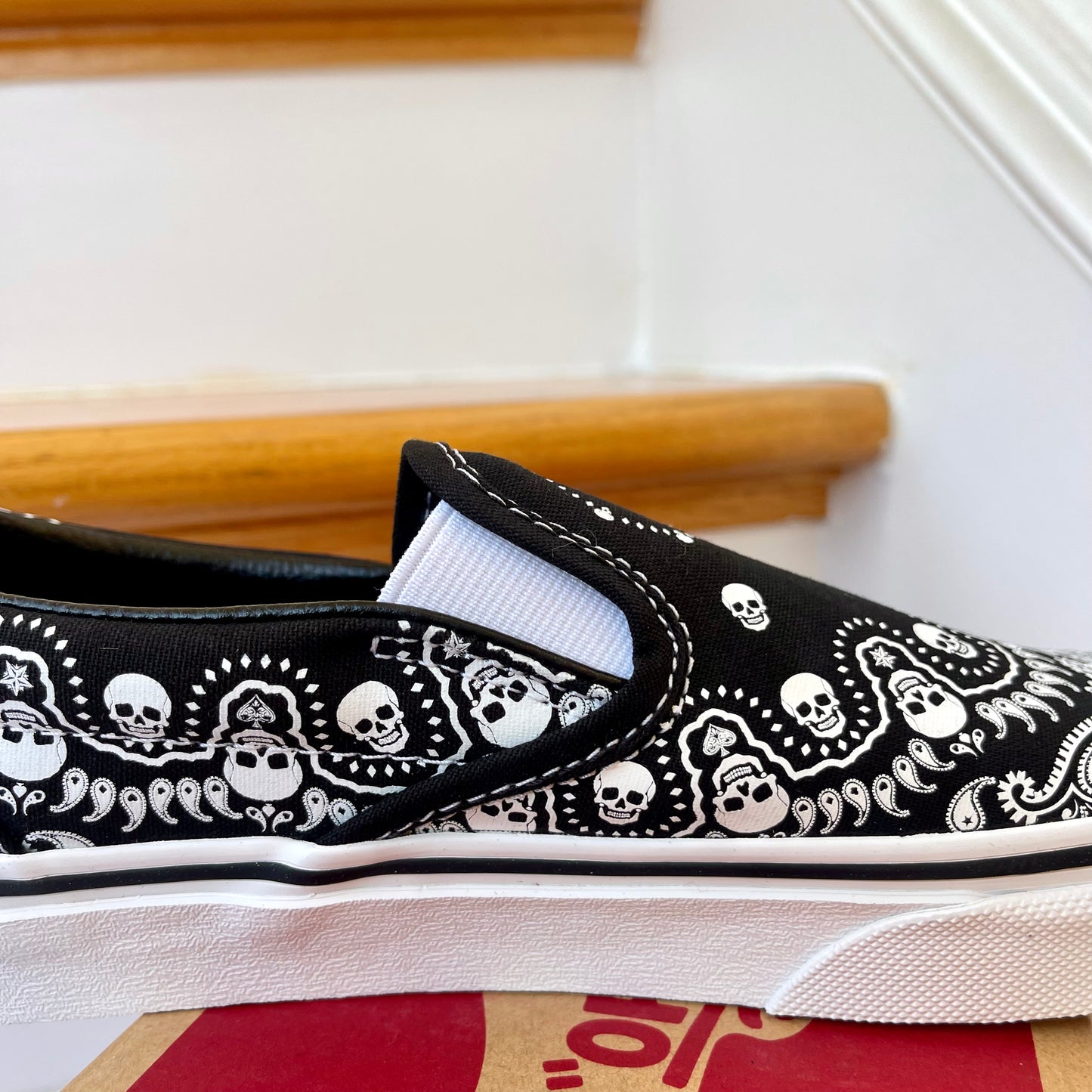 Vans Classic Slip On shoes in black / white bandana skull skate sneaker