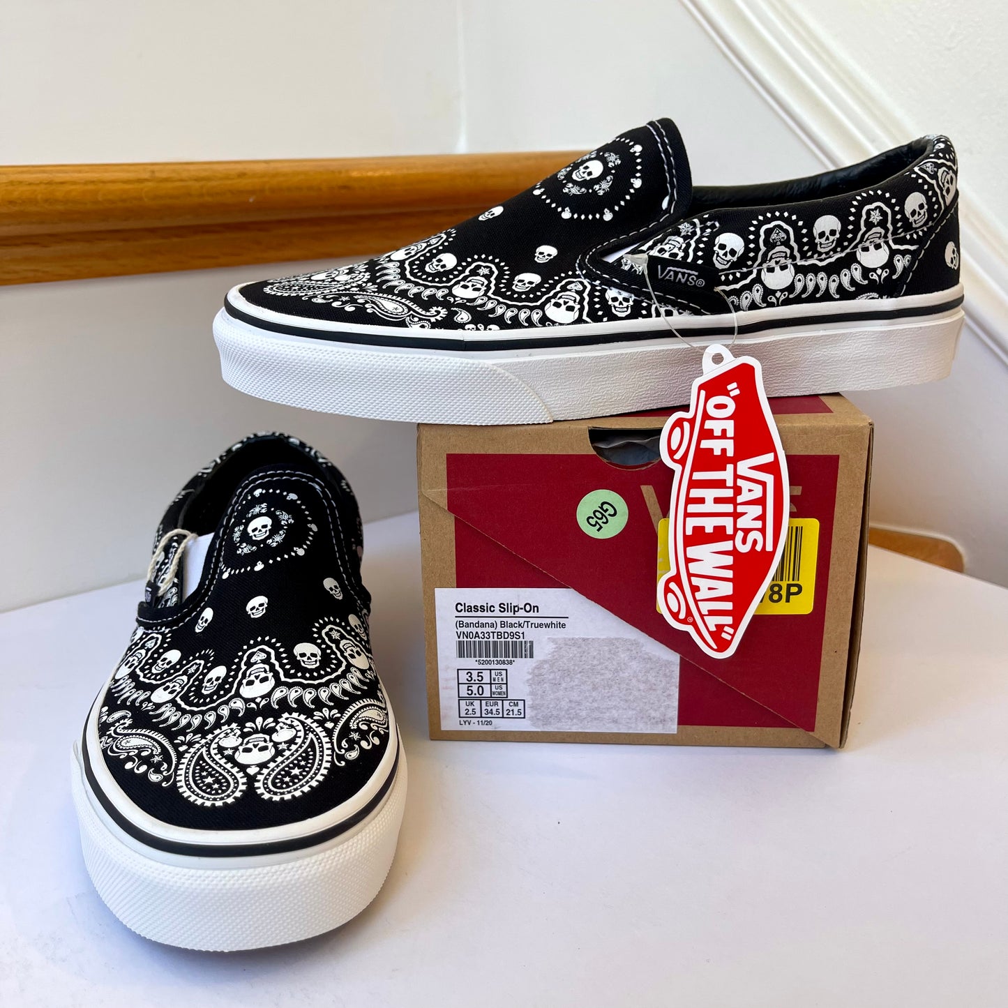Vans Classic Slip On shoes in black / white bandana skull skate sneaker