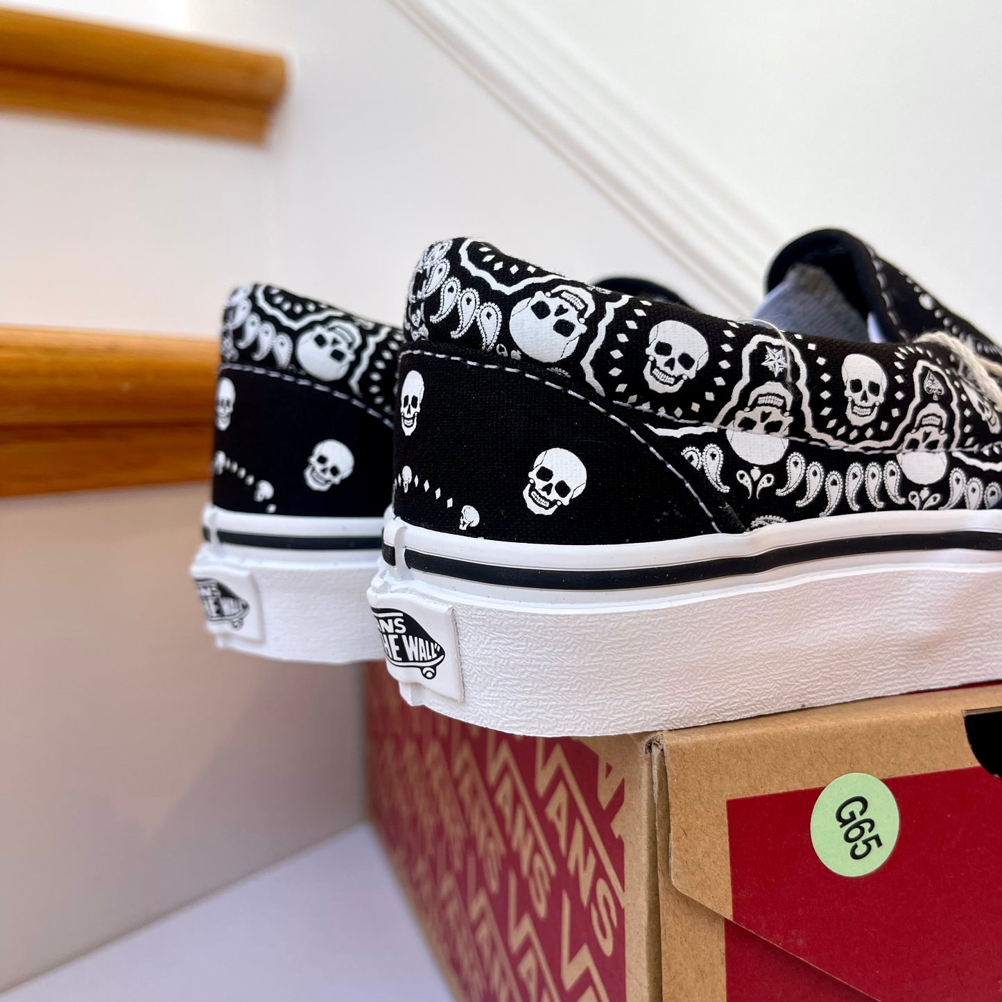 Vans Classic Slip On shoes in black / white bandana skull skate sneaker