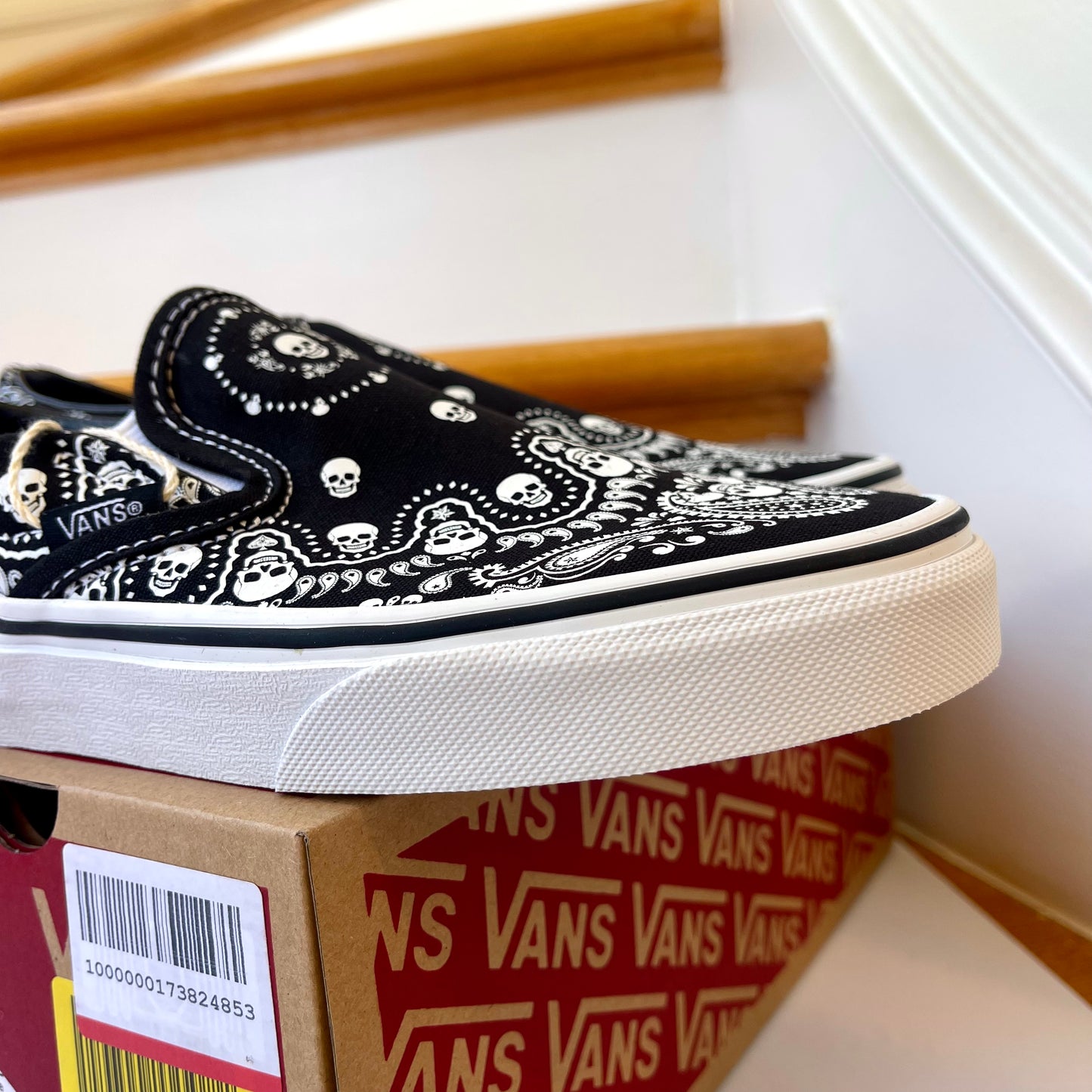Vans Classic Slip On shoes in black / white bandana skull skate sneaker