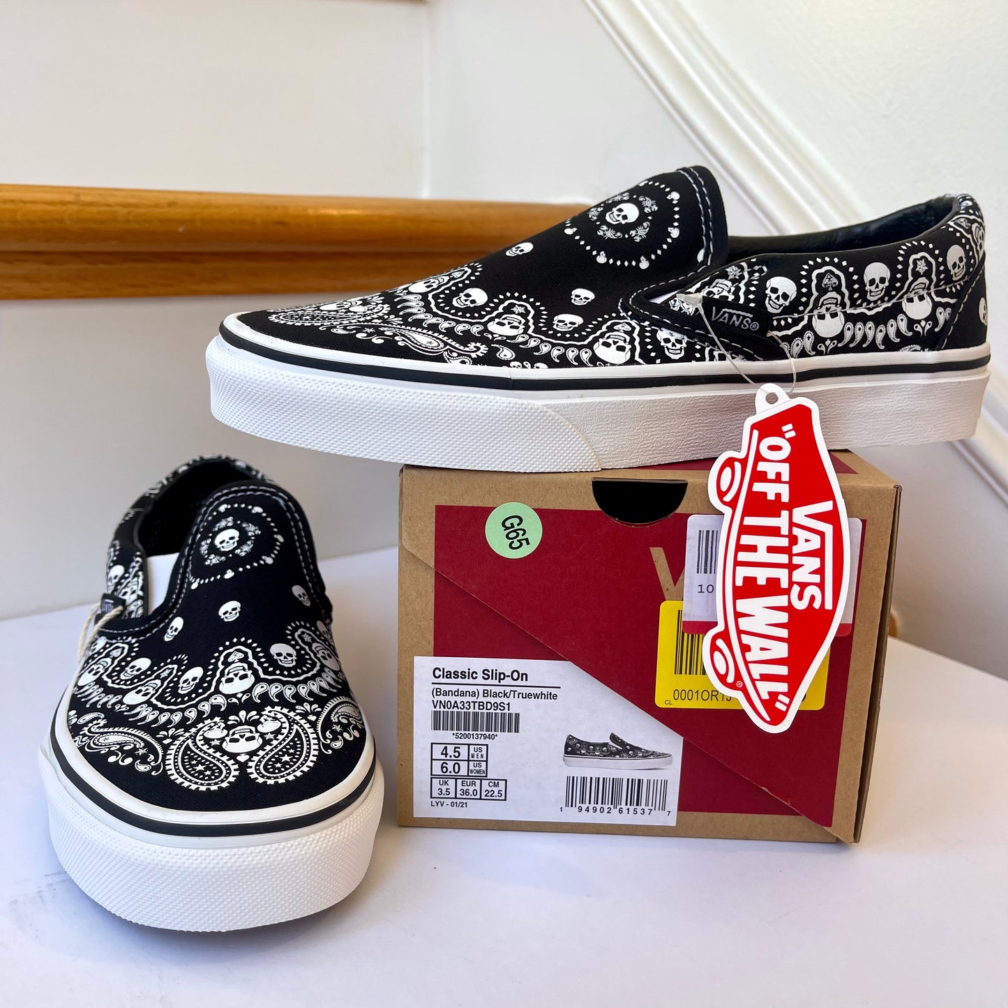 Vans Classic Slip On shoes in black / white bandana skull skate sneaker