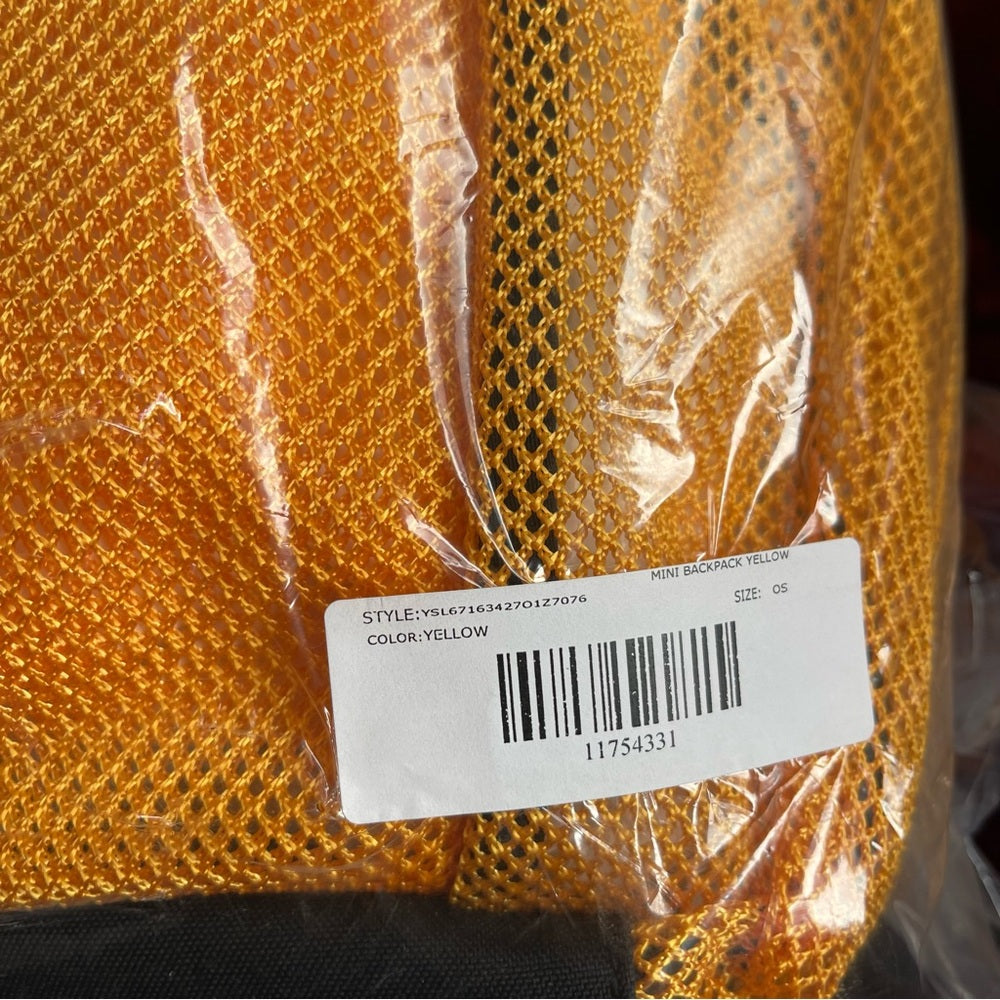 Yves Saint Laurent Yellow backpack mesh with black trim / straps - brand new